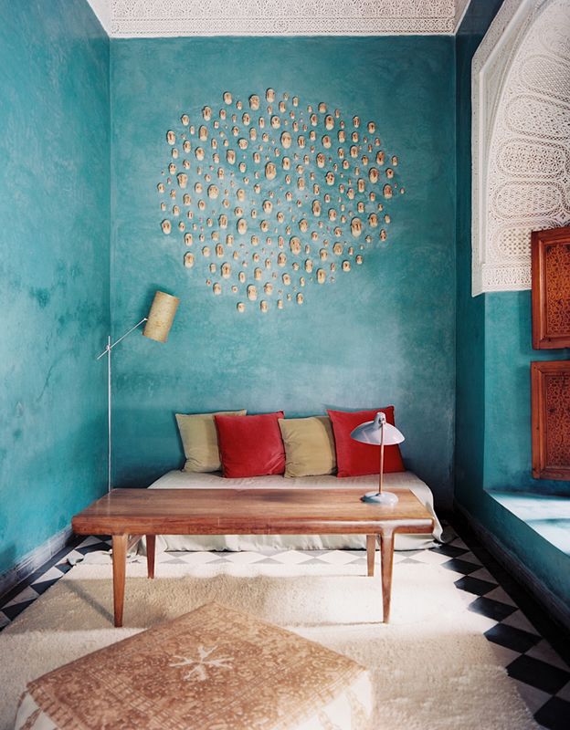 This amazing aqua accent wall makes this space inviting and bright