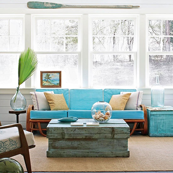 Aqua home decor doesn't have to overwhelm the room - simple touches like this couch and refurbished chest table add a lot of personality