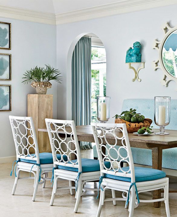 All the different shades of aqua and blue in this dining room are subtle but sweet