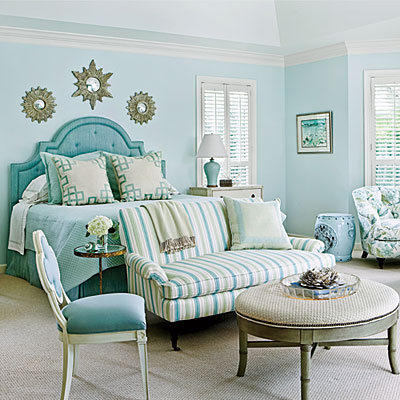 this gorgeous coastal themed room brings the beach inside with different shades of aqua, tan and gold