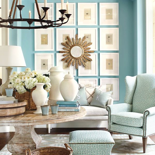 This bright aqua living room is balanced with stunning white decor for a fresh and colorful look