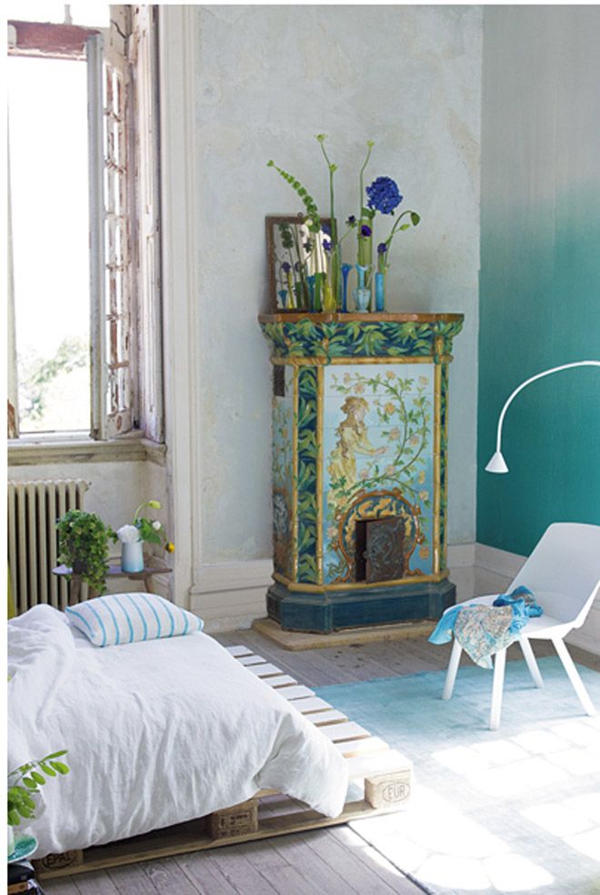 This gorgeous countryside style bedroom has an ombre aqua wall - brilliant!