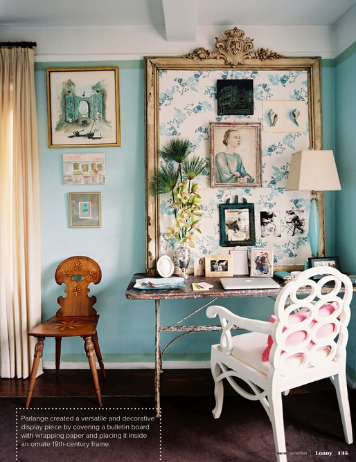 The vintage elements in this room, like the bulletin board and metal desk pair well with the bright aqua colored wall