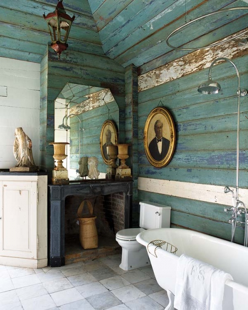 This farmhouse style bathroom has aqua weathered wood walls