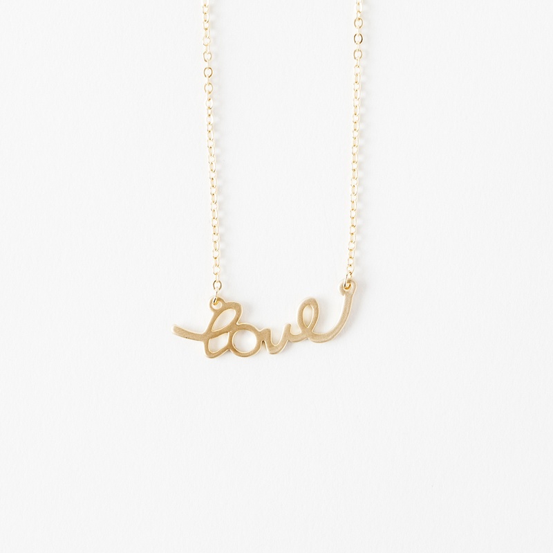 What girl doesn't love an adorable script necklace?