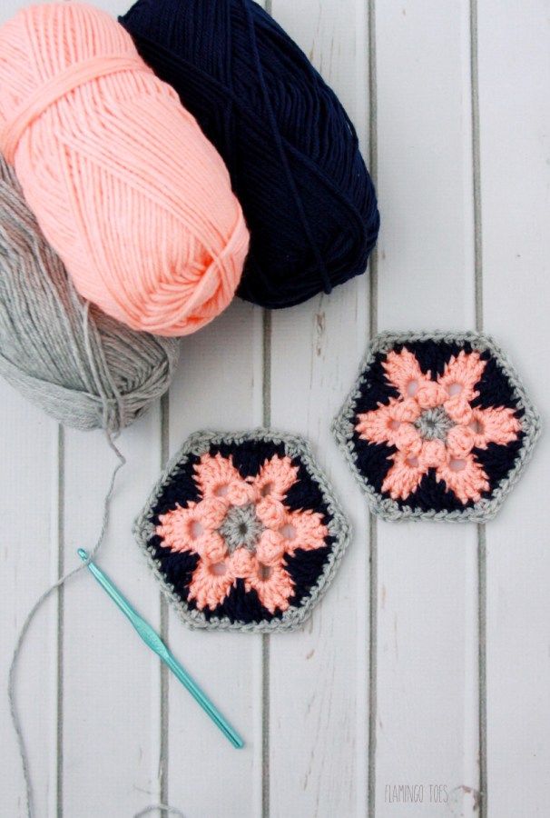 This hexagon crochet pattern made with pink, navy, and gray ribbon is adorable. 