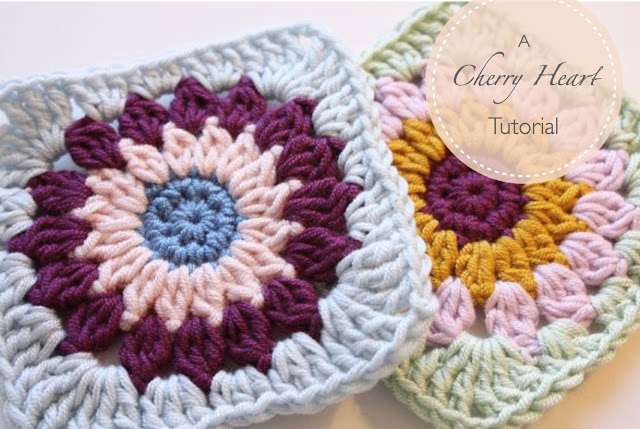 These cherry heart granny squares are crocheted different colors that compliment each other.