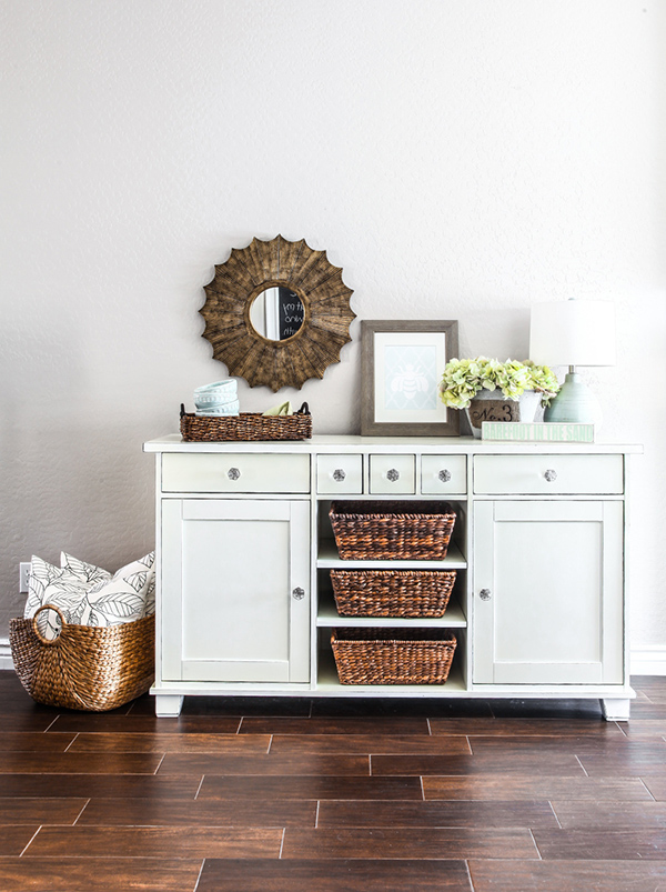 This IKEA dresser is a gorgeous hallway storage center with woven baskets and cute accessories