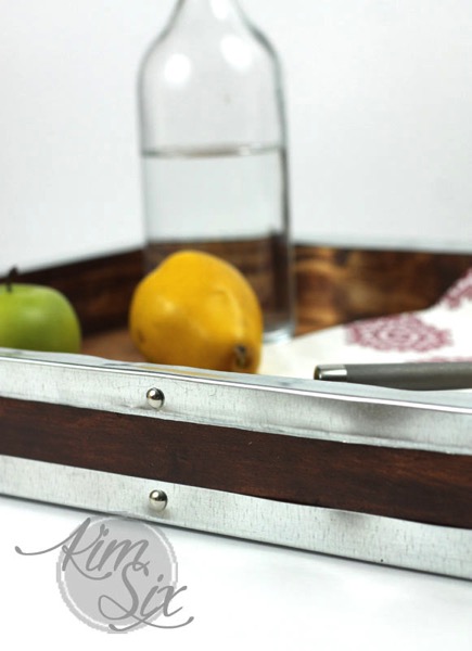 This wooden drink tray with silver accents is industrial farmhouse. 