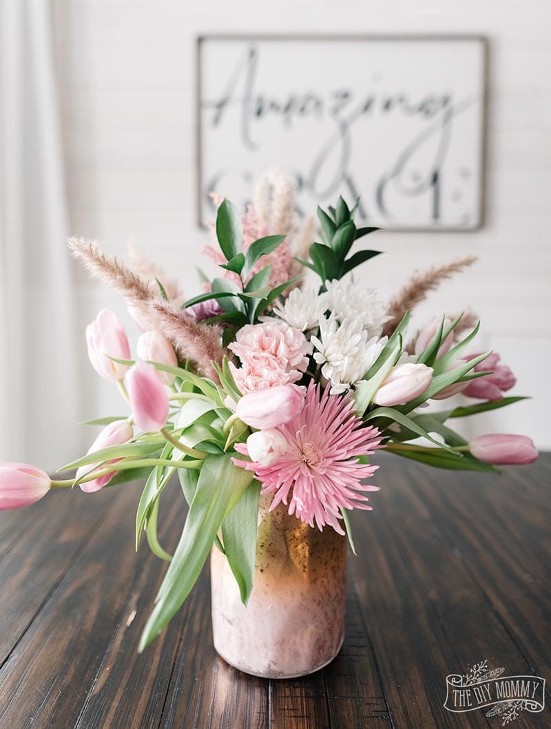 Adding a touch of Spring with Farmhouse Flower Ideas is a quick and easy way of adding charm, a pop of pretty and freshness to any room or space.