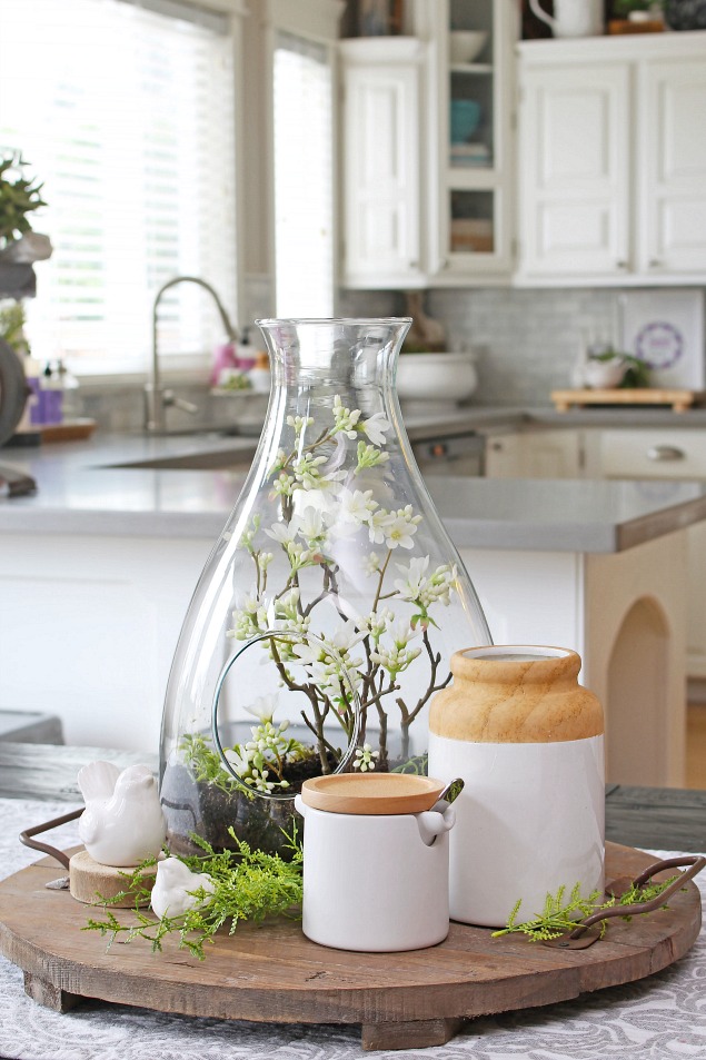 This DIY spring greenery center piece adds brightness to the kitchen space.