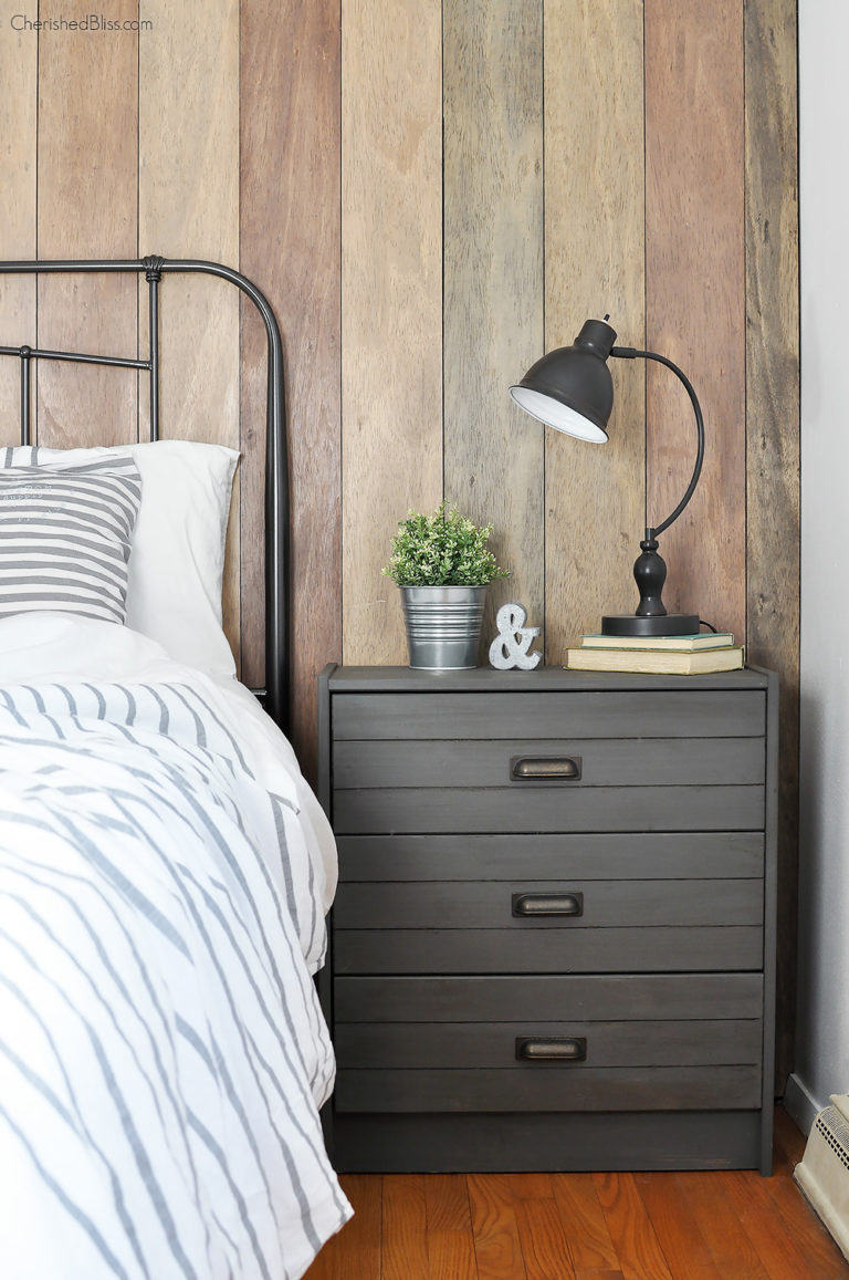 This gray industrial nightstand works great with the other shades of wood in the farmhouse room.