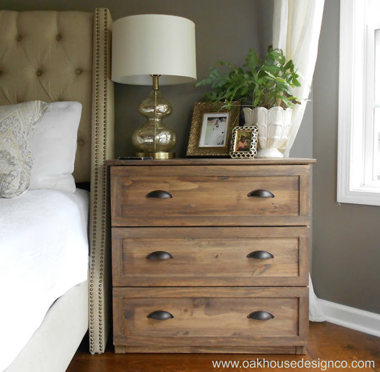 This light stained nightstand adds farmhouse flair to the modern room.