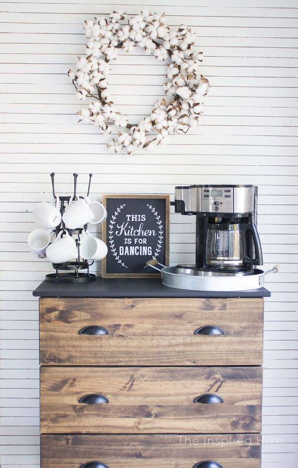 This coffee bar area evokes farmhouse with the shiplap drawers and cotton wreath.