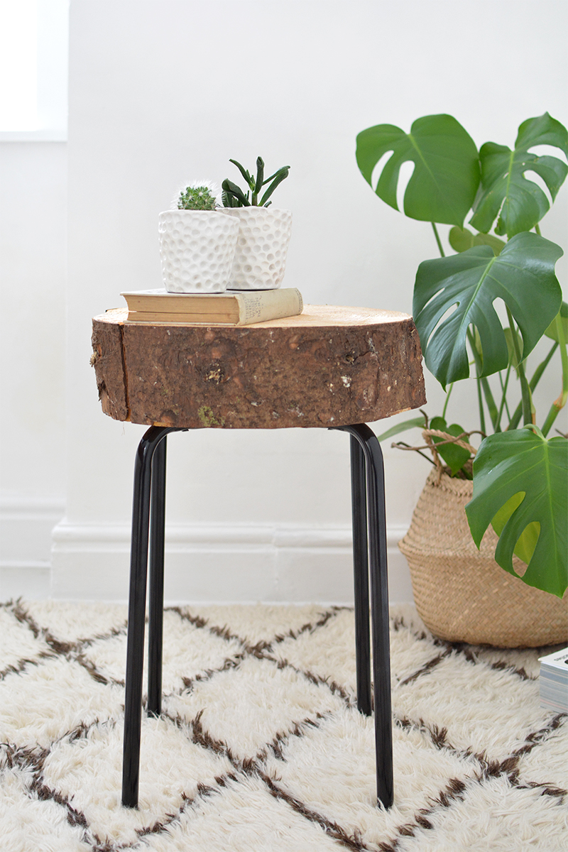 This IKEA side table got a major upgrade when this DIYer removed the simple wooden table surface and replaced it with a tree chunk log - perfect country chic style!