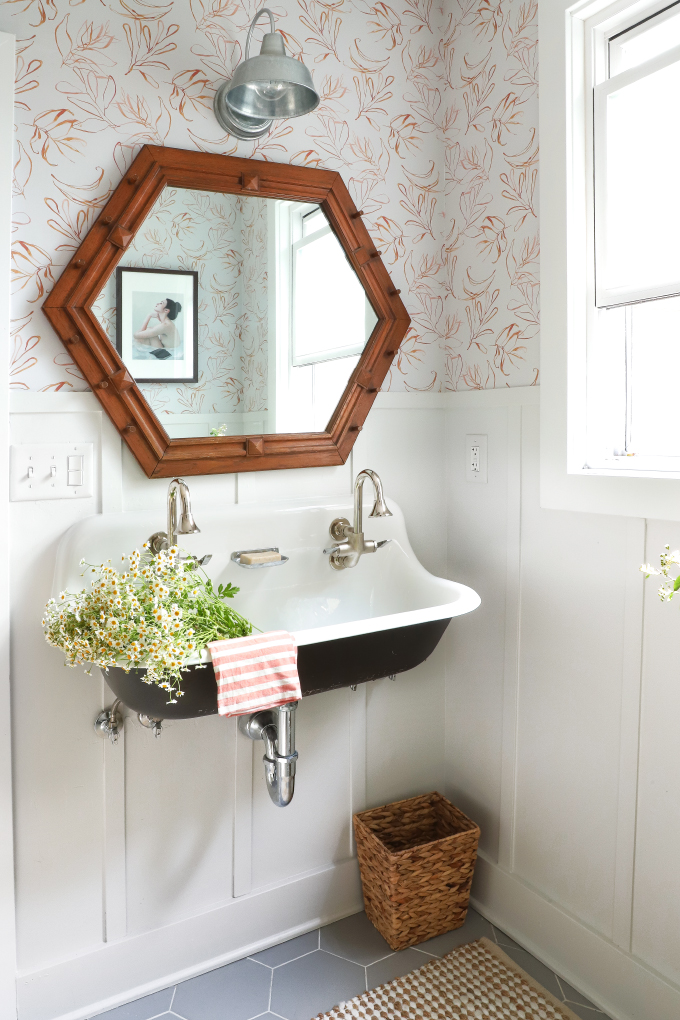This farmhouse style double sink is the perfect touch in this bathroom