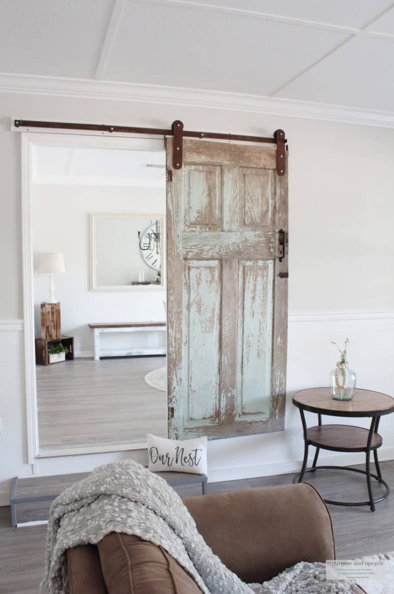 What is more perfect farmhouse home decor than a sliding barnwood door?