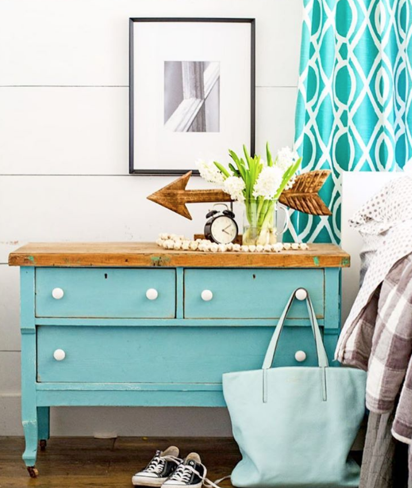 This blue bedside dresser with white handles is coastal and bright. 