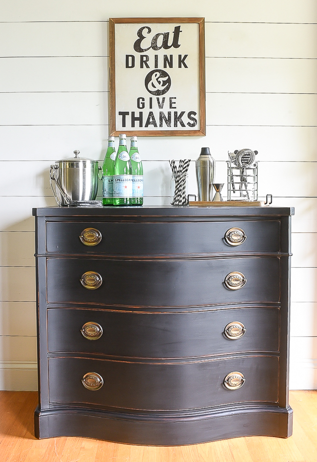 This refinished dark stained dresser makes the most adorable bar area. 