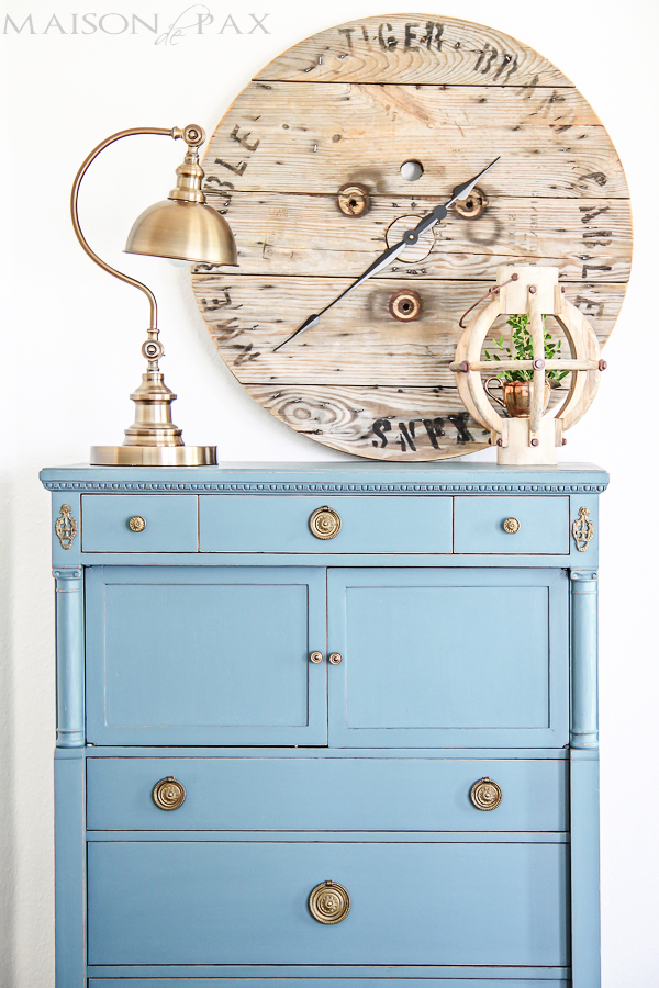 This light blue dresser is unique and looks great with the large wooden clock.