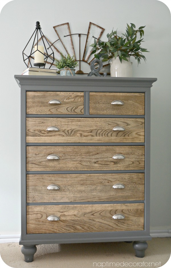 This gray dresser with silver handles and wood drawers is a one of a kind farmhouse piece. 