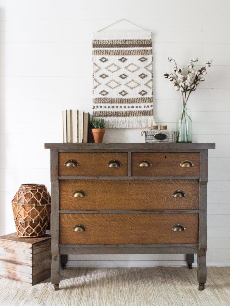 Thrift store dressers are ideal candidates for industrial style makeovers like this dark wooden dresser