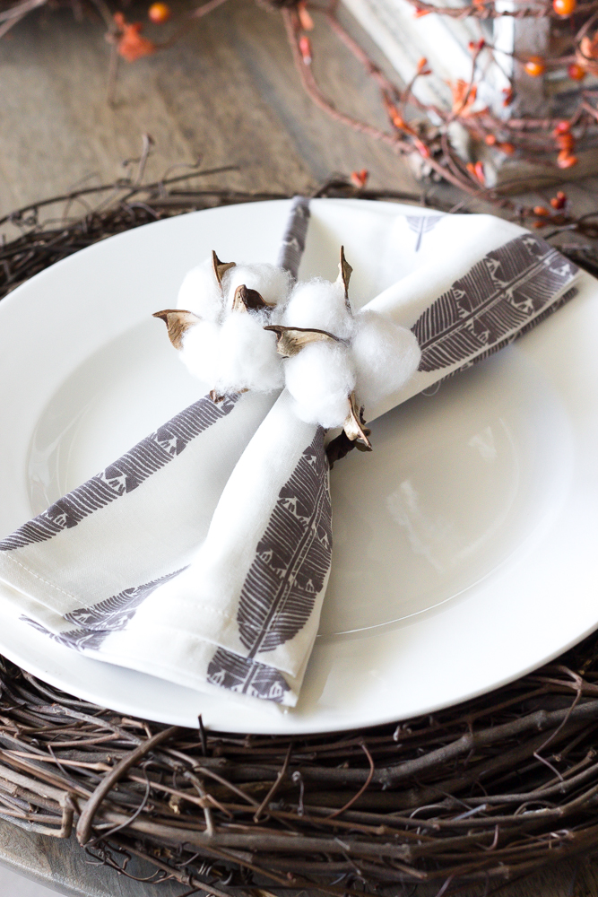 These cotton candle holders pair well with the table's Autumn theme.