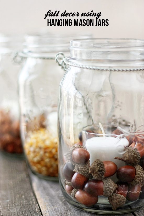 These hanging mason jars filled with acorns are perfect for fall. 
