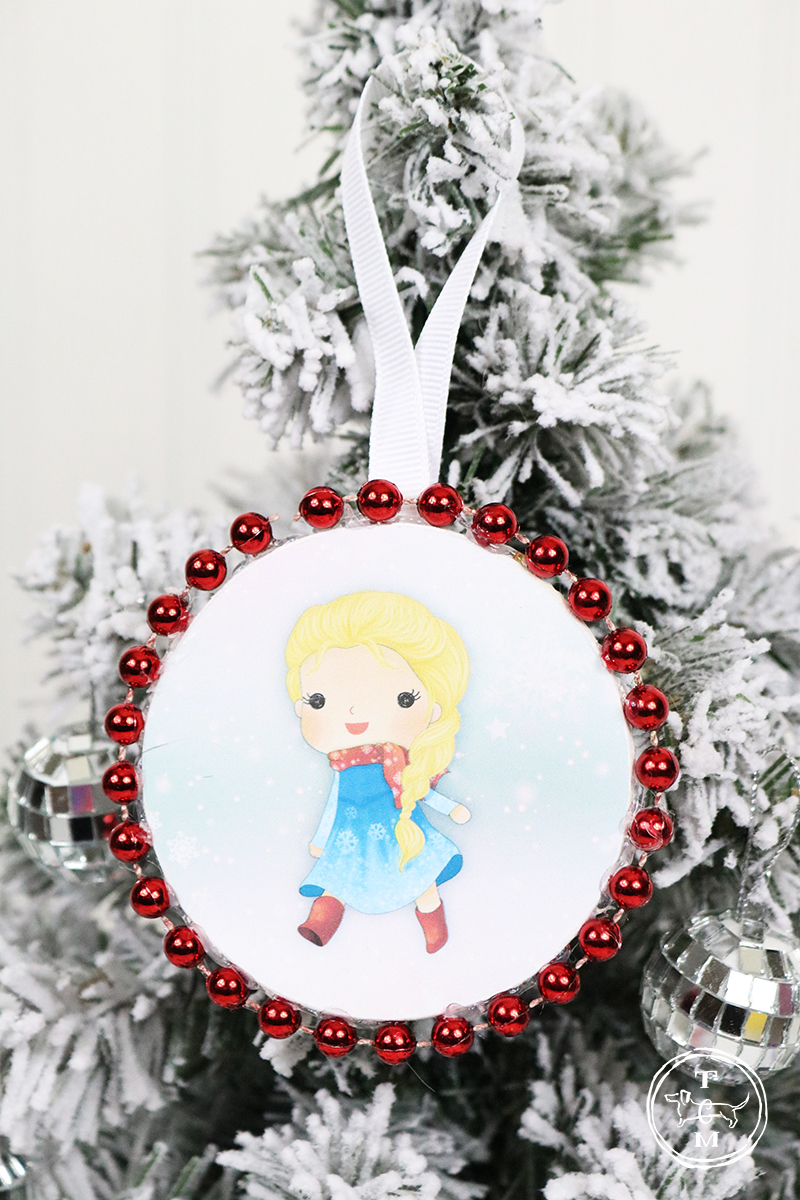 These DIY Dollar Store Christmas Ornaments with Free Printables are Magical. Come and join Harry Potter and Friends, Spiderman and Friend, The Star Wars Gang and the Pretty Princesses!