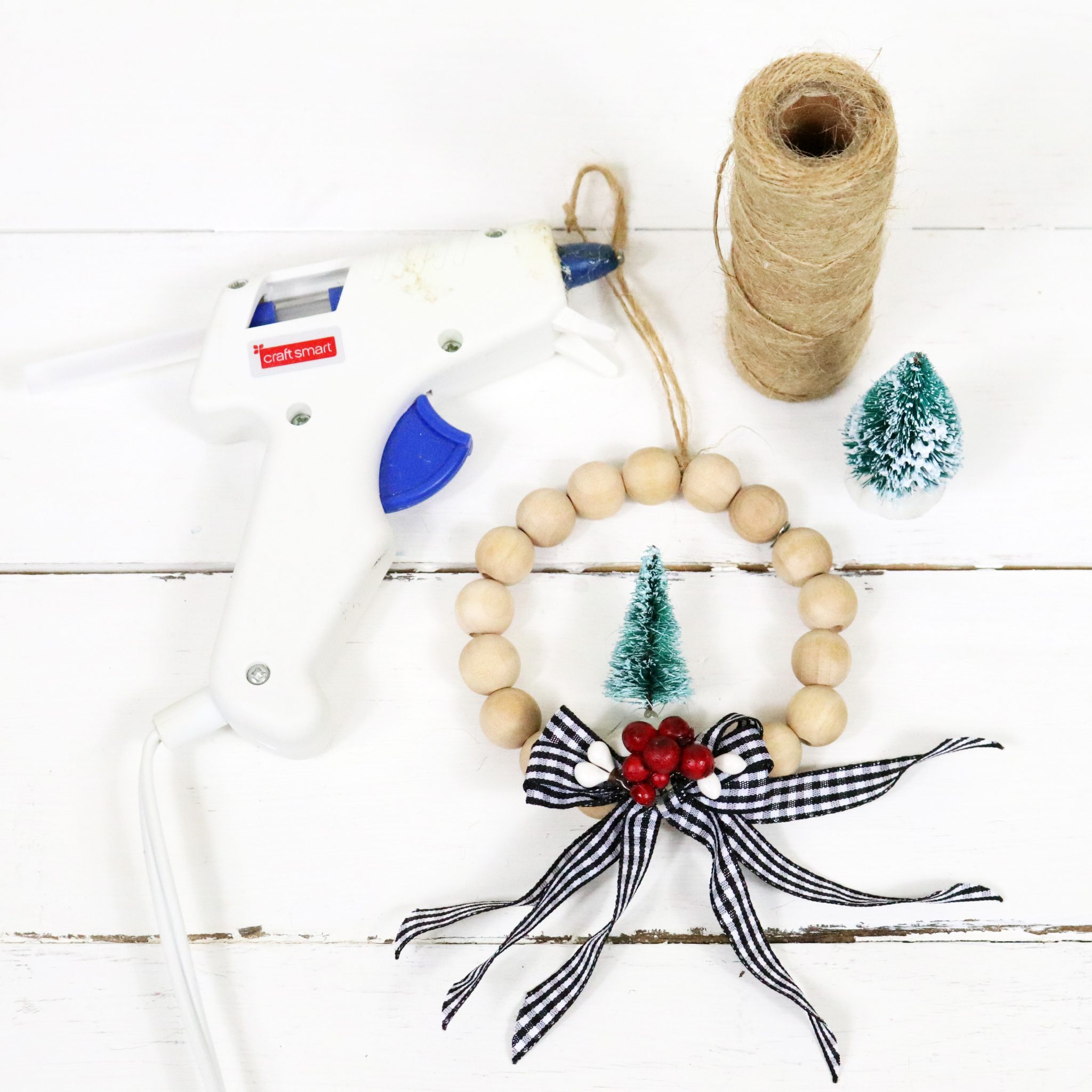 It's time for another Quick and Easy DIY Craft, today we are featuring DIY Farmhouse Wood Bead Wreath Ornaments that will look wonderful on your tree and perfect on your packages!