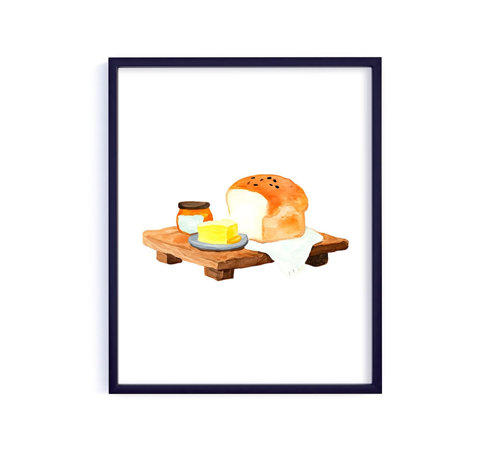 A warm, rustic scene featuring a fresh loaf of bread on a wooden board with a pat of butter and a little jar beside it. It feels comforting and homey… like a quiet morning in the kitchen.